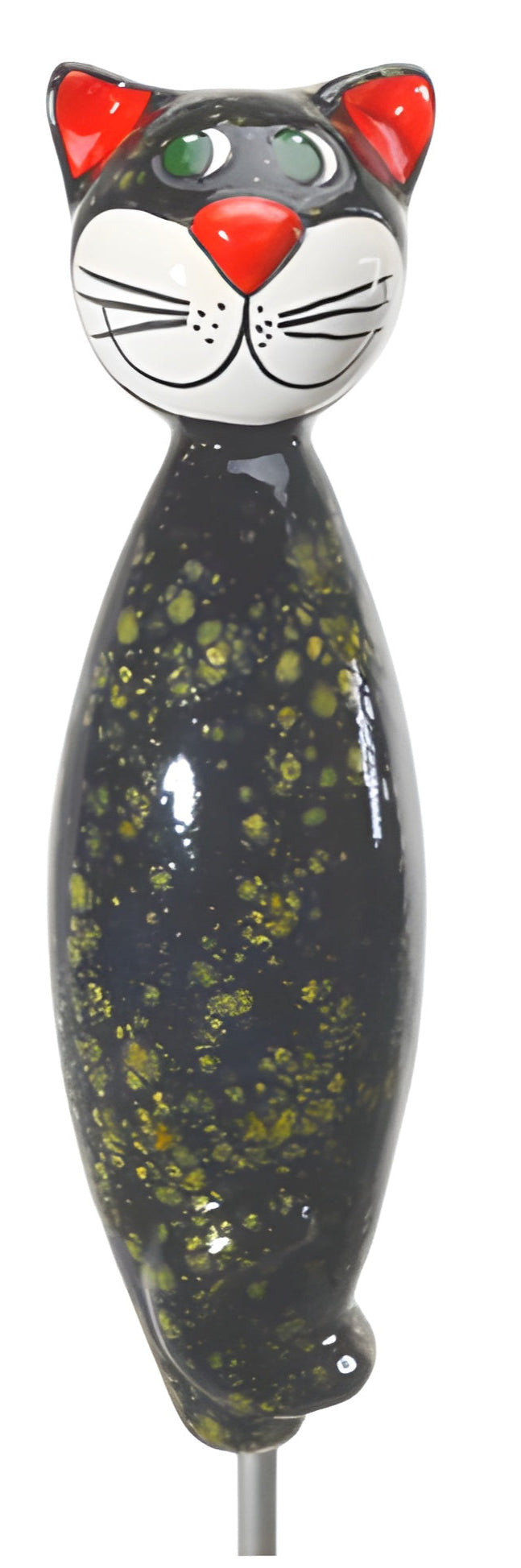 Decorative cat-shaped object with black and green speckled body, red ears, and white face on a white background.