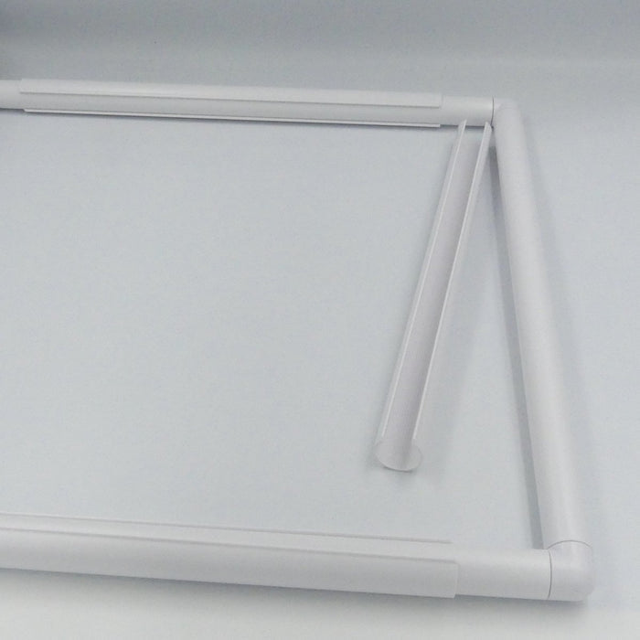 C-Shaped clamp next to a Quilt Frame.