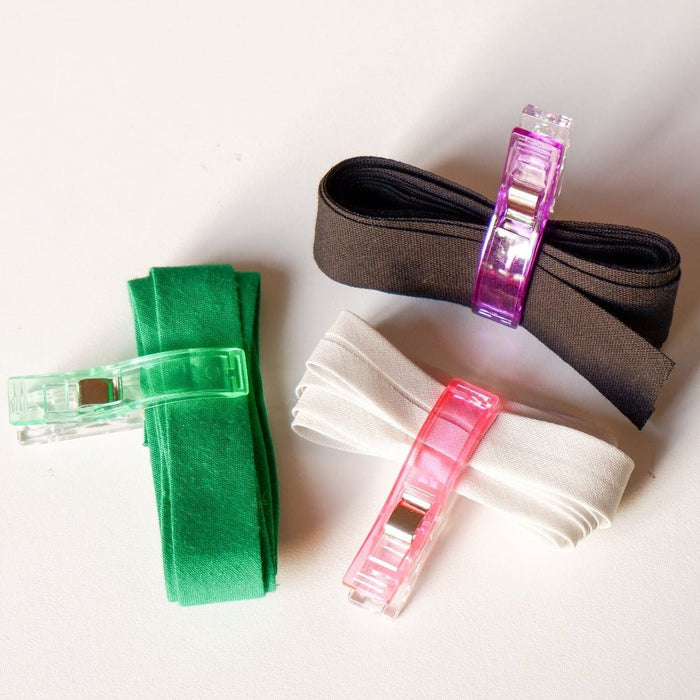 big sewing clips holding bias tape together